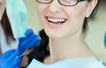 Female patient receiving dental treatment