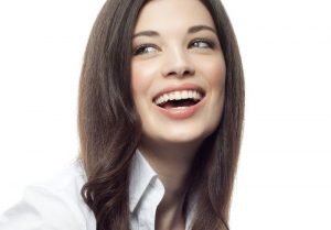 A woman with a bright white, healthy smile