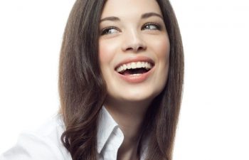 A woman with a bright white, healthy smile