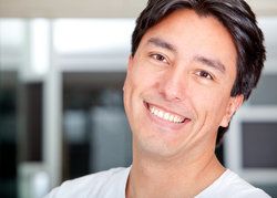 A man smiling in his home