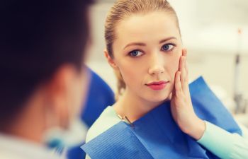 Woman in Dentist Chair with Tooth Pain Atlanta GA