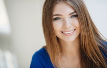 Cheerful young woman with a perfect smile.