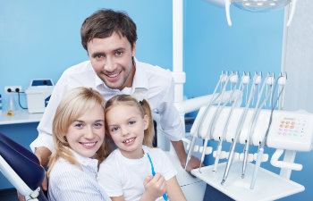 happy family in the dentists office